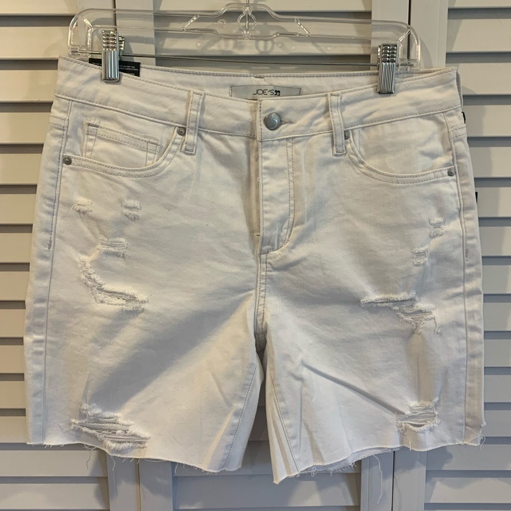Joe’s white Bermuda shorts